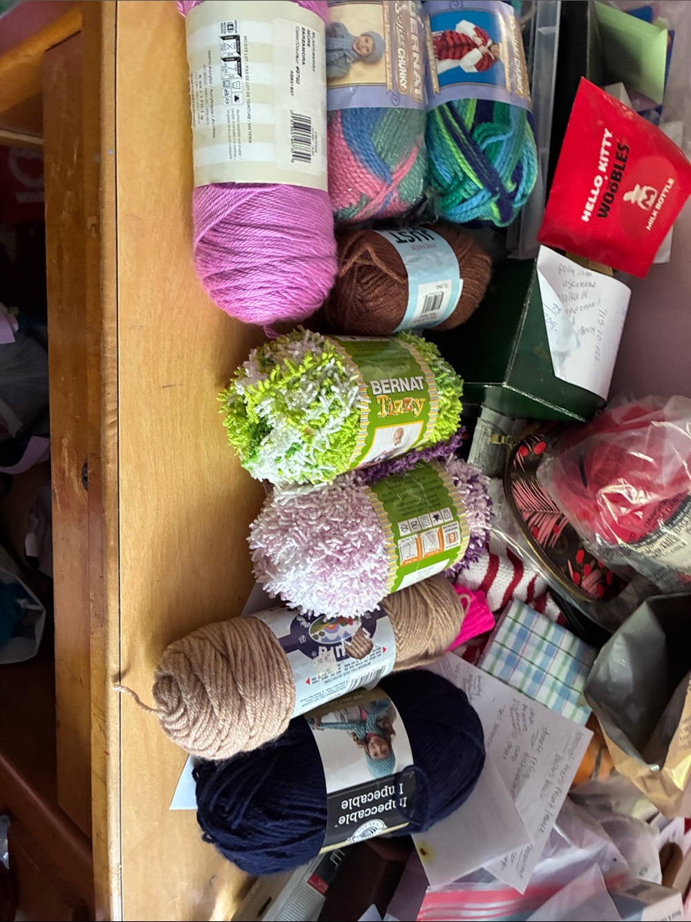 Assorted full skeins of yarns all different colors